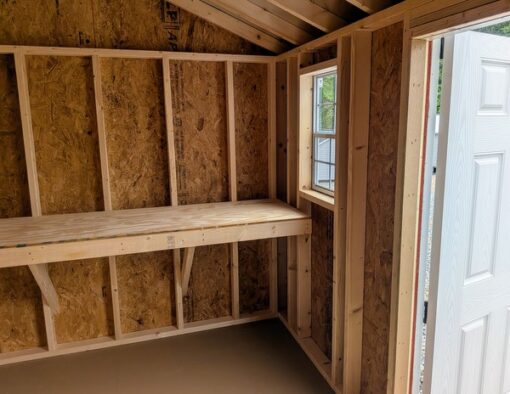 8x12 size vinyl a-roof style shed with pearl siding, white trim, black architectural shingle roof, black shutters. Has 8' ridge vent, 6 foot fiber double doors and one window.