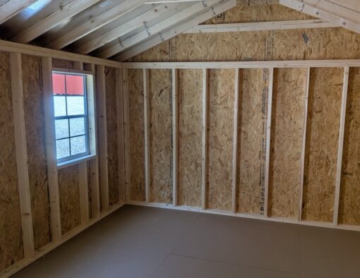 12x20 size vinyl a-roof style shed with white siding, white trim, black metal roof, black shutters. Has 6 foot fiber double doors and two windows.