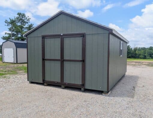 12 x 16 size painted a-roof style shed with avocado siding, brown trim, brownwood architectural shingle roof, brown shutters, (1) 8' ridge vent, ggs 6 foot double doors, two windows.