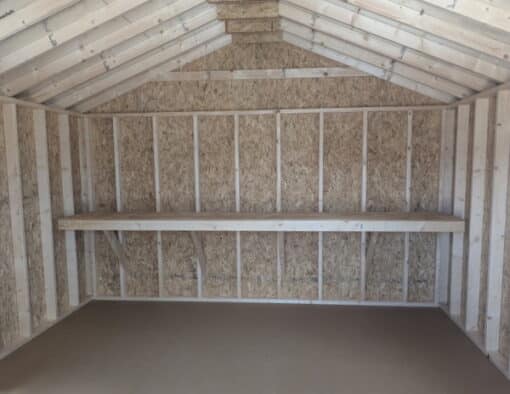12 x 16 size painted a-roof style shed with avocado siding, brown trim, brownwood architectural shingle roof, brown shutters, (1) 8' ridge vent, ggs 6 foot double doors, two windows.