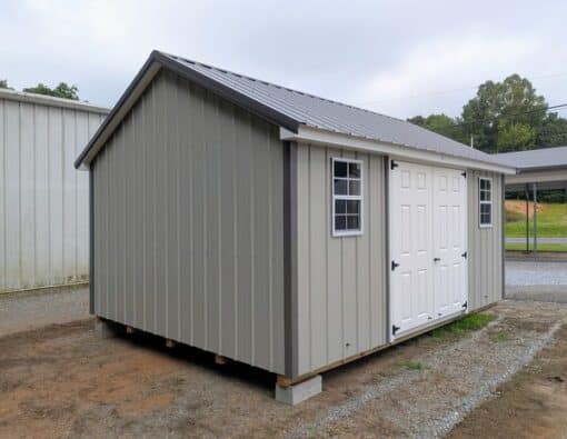 12x16 size metal classic style shed with white trim, gray metal siding, charcoal metal roof, corners and j channel, 6 foot fiber double shed doors with two windows.