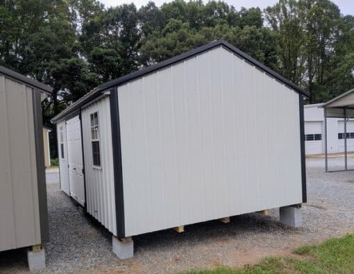 12x20 size metal a-roof style shed with black trim, alamo metal siding, black metal roof, corners and j channel, 6 foot fiber double shed doors with two windows.