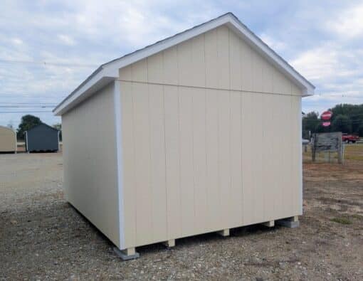 10 x 14 size painted classic style shed with navajo white siding, white trim, brownwood architectural shingle roof, clay shutters, fiber solid 6 foot double shed doors, two windows.