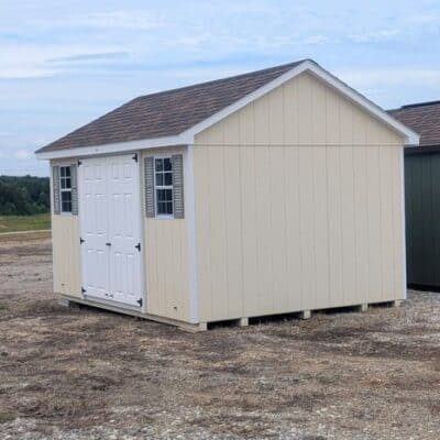 10 x 14 size painted classic style shed with navajo white siding, white trim, brownwood architectural shingle roof, clay shutters, fiber solid 6 foot double shed doors, two windows.