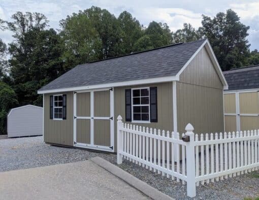 12 x 20 size painted garden style shed with clay siding, white trim, black architectural shingle roof, black shutters, (2) 8' ridge vents, ggs 6 foot double doors, two windows.