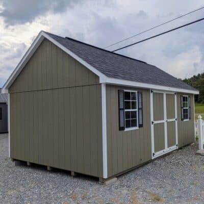 12 x 20 size painted garden style shed with clay siding, white trim, black architectural shingle roof, black shutters, (2) 8' ridge vents, ggs 6 foot double doors, two windows.