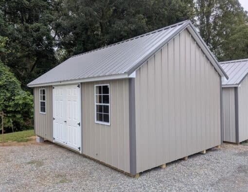 12x20 size metal garden style shed with white trim, taupe metal siding, charcoal metal roof, corners and j channel, 6 foot fiber double shed doors with two windows.