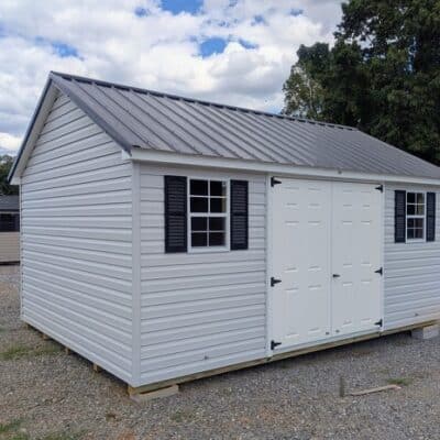 12 x 16 size vinyl classic style shed with gray siding, white trim, black metal roof, black shutters, fiber solid 6 foot double shed doors, two windows.