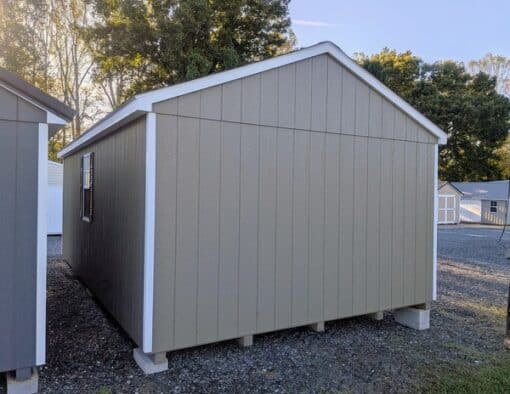 12 x 20 size painted a-roof style shed with clay siding, white trim, driftwood architectural shingle roof, black shutters, (2) 8' ridge vents, ggs 6 foot double doors, two windows.