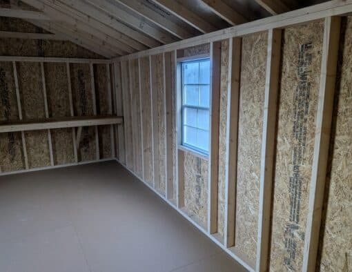 12 x 20 size painted a-roof style shed with clay siding, white trim, driftwood architectural shingle roof, black shutters, (2) 8' ridge vents, ggs 6 foot double doors, two windows.