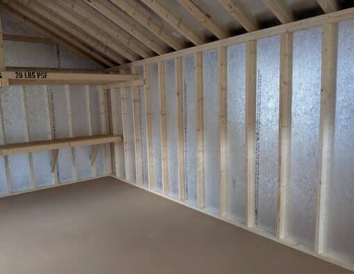 14 x 28 size painted classic garage style shed with gray siding, white trim, black metal roof, black shutters, garage door with glass, ggs 6 foot double doors 1' ft taller, two windows.