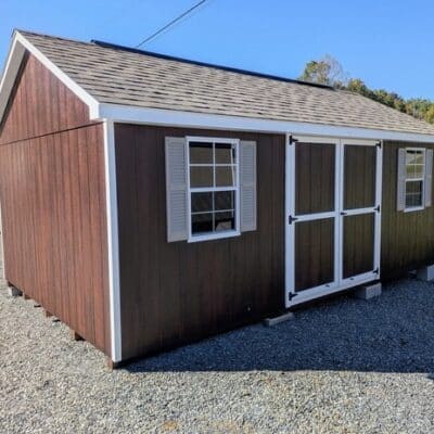 12 x 20 size painted classic style shed with stain mahogany siding, white trim, driftwood architectural shingle roof, clay shutters, (2) 8' ridge vents, ggs 6 foot double doors, two windows.