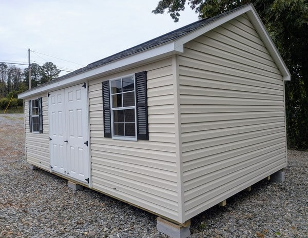 12x20 size vinyl classic roof style shed with mist siding, white trim, estate gray architectural shingle roof, black shutters. has (2) 8' ridge vents, 6 foot fiber double doors and two windows.