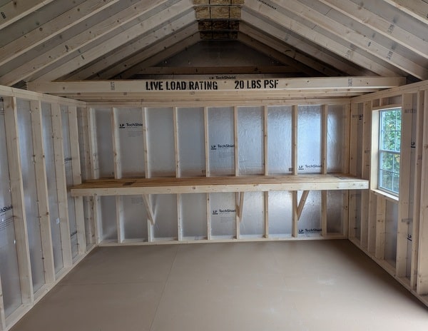 12x20 size vinyl classic roof style shed with mist siding, white trim, estate gray architectural shingle roof, black shutters. has (2) 8' ridge vents, 6 foot fiber double doors and two windows.