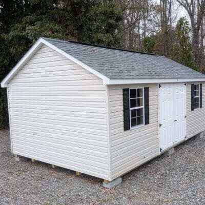 12x20 size vinyl classic roof style shed with mist siding, white trim, estate gray architectural shingle roof, black shutters. has (2) 8' ridge vents, 6 foot fiber double doors and two windows.