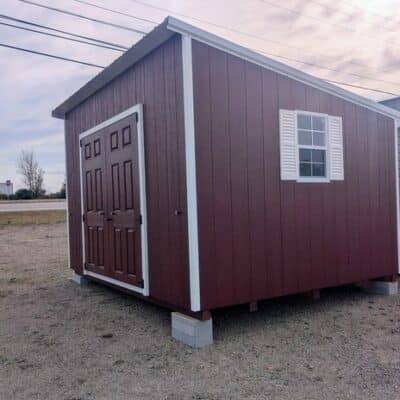 10x12 size painted economy style shed with pinnacle red siding, white trim, alamo metal roof, white shutters, fiber solid 6 foot doors painted same color as the shed with two windows.
