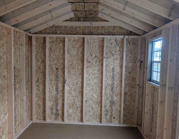 8 x 12 size painted a-roof style shed with clay siding, white trim, driftwood architectural shingle roof, black shutters, (1) 8' ridge vent, fiber solid 6 foot double doors, one window.