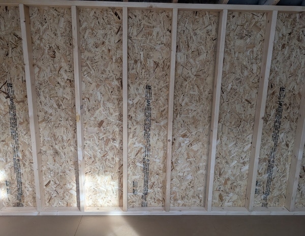 8 x 12 size painted a-roof style shed with clay siding, white trim, driftwood architectural shingle roof, black shutters, (1) 8' ridge vent, fiber solid 6 foot double doors, one window.