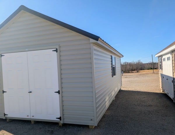 12 x 20 size vinyl classic style shed with olive siding, olive trim, black metal roof, black shutters, fiber solid 6 foot double shed doors, two windows.