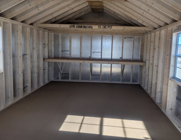 12 x 20 size vinyl classic style shed with olive siding, olive trim, black metal roof, black shutters, fiber solid 6 foot double shed doors, two windows.