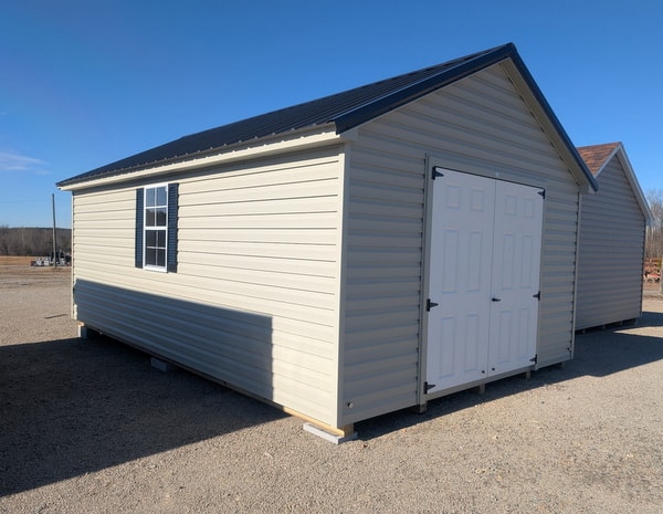 12 x 20 size vinyl classic style shed with olive siding, olive trim, black metal roof, black shutters, fiber solid 6 foot double shed doors, two windows.