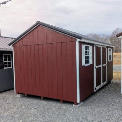 10 x 16 size painted a-roof style shed with pinnacle red siding, white trim, black metal roof, white shutters, ggs 6 foot double doors, two windows.