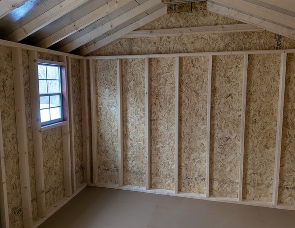 10 x 16 size painted a-roof style shed with pinnacle red siding, white trim, black metal roof, white shutters, ggs 6 foot double doors, two windows.