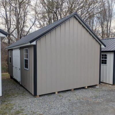 12x20 size metal garden style shed with white trim, taupe metal siding, black metal roof, corners and j channel, 6 foot fiber double shed doors with two windows.