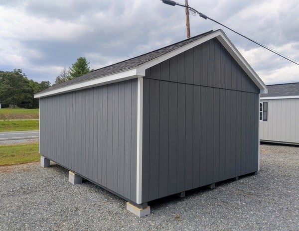 12 x 20 size painted classic style shed with gray siding, white trim, black architectural shingle roof, black shutters, (2) 10' ridge vents, ggs 6 foot double doors, two windows.