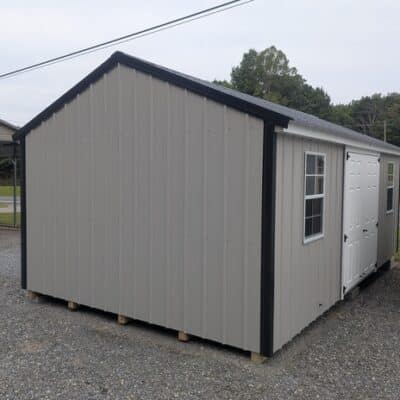 12x20 size metal a-roof style shed with white trim, gray metal siding, black metal roof, corners and j channel, 6 foot fiber double shed doors with two windows.
