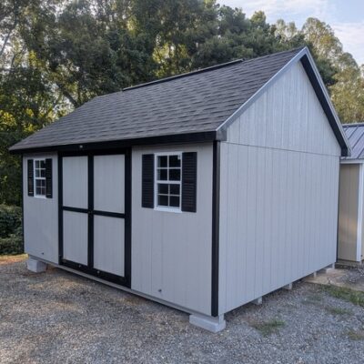 12 x 16 size painted garden style shed with gap gray siding, black trim, black architectural shingle roof, black shutters, (1) 10' ridge vent, ggs 6 foot double doors, two windows.